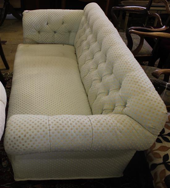 Victorian button-back three-seat sofa, covered in geometric-patterned ivory ground fabric